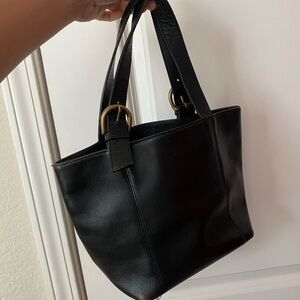 Black handheld leather bag
